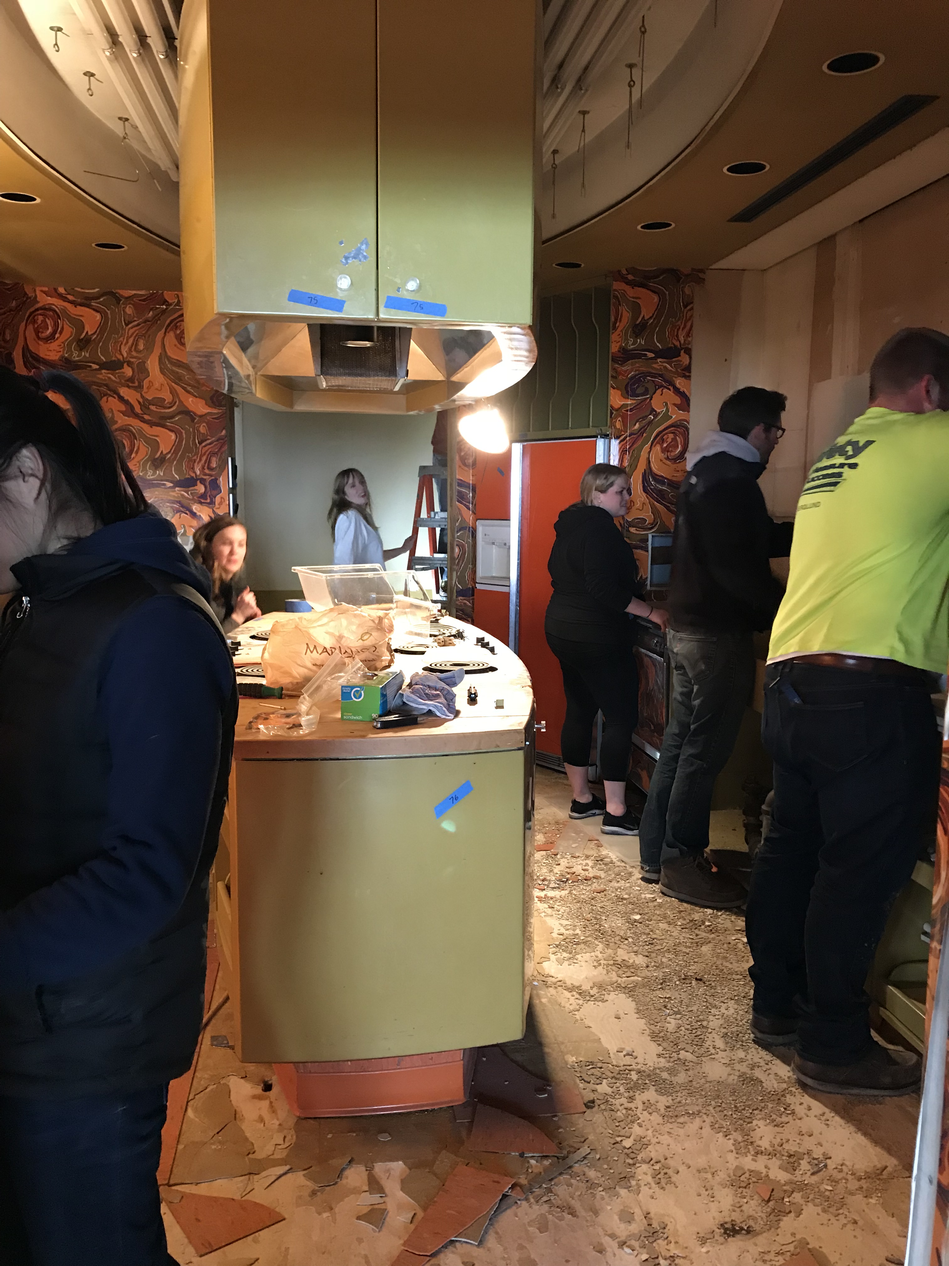 Landmarks Illinois volunteers disassemble the Ebony Test Kitchen